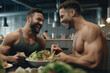 © FutureStock - Happy sporty gay couple on fitness diet eating a healthy green salad with vegetables at gym canteen.