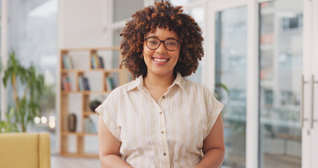 Happy, smile and face of a woman in the office with a positive, good and confidence mindset. Happiness, excited and portrait of a professional female employee from Mexico standing in modern workplace