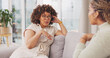 © Azee/peopleimages.com - Talking, bonding and friends sharing a story, secret or gossip on the sofa together. Happy, relax and women on the living room couch for advice, communication and catching up conversation at home