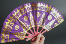 texture of Traditional Balinese hand fan patterned prada   isolated on dark background