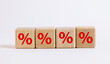 © Alek - Red percentage symbol on four wooden cubes with copy space concept of sales and discounts