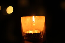 Light In The Darkness Of A Small Candle Create A Warm And Hope
