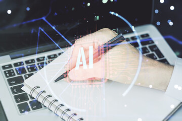 Poster - Double exposure of creative artificial Intelligence abbreviation with hand writing in notepad on background with laptop. Future technology and AI concept
