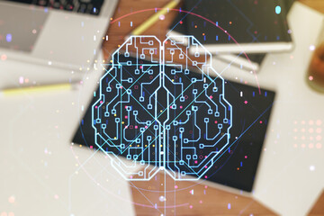 Poster - Creative artificial Intelligence concept with human brain hologram and modern digital tablet on background, top view. Multiexposure