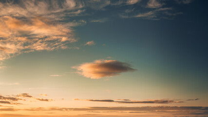 Poster - Dramatic colorful sky with clouds in the sunset