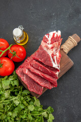 top view sliced fresh meat with tomatoes and greens on a dark background meat animal barbecue butcher food color meal