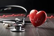 Stethoscope and red heart on wooden table