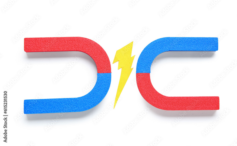 Paper lightning with horseshoe shaped magnets on white background