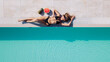 © JJ Studio - Zenith aerial view of a swimming pool in summer