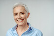 © Maria Vitkovska - Caucasian gray haired senior woman smiling broadly looking at camera