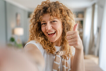 Portrait of one adult caucasian woman at home happy smile curly hair