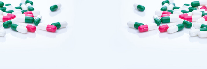 Poster - Capsules pill spread on white background. Prescription drugs. Capsule pill frame banner. Green, pink, and white color capsule pills. Pharmaceutical industry. Medication and pharmacology. Health care.