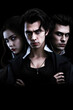 Three attractive vampires on a black background. Cover of a vampire novel. Generative AI illustration. Vintage style.