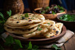 a stack of oriental flatbreads with greens on the table close-up