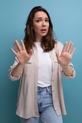 Canvas Print - confused brunette young brunette lady dressed in shirt and jeans