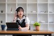 © chartchai - Asian girl student online learning class study online video call zoom teacher, Happy asian girl learn english language online with computer laptop..