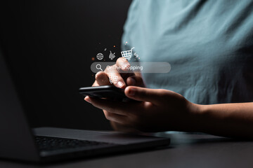 young woman using phone and laptop with online shopping cart icon online shopping concept