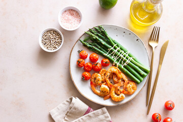 Fried shrimp with asparagus and tomatoes. Healthy eating. Diet.