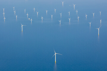 Aerial view of offshore wind farm with wind turbines on the North Sea