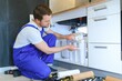 © Serhii - plumber change the water filter