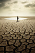 © Degimages - Drought, drought and global warming concept with men. Cracked ground.