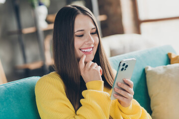 Sticker - Portrait of nice lovely person sitting comfort sofa use smart phone finger touch lips typing post spend pastime indoors