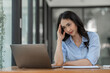 © crizzystudio - Asian businesswoman having stress, headache, office syndrome As a result of hard work on financial investment documents in Real estate business Document work for analysis management system concept.