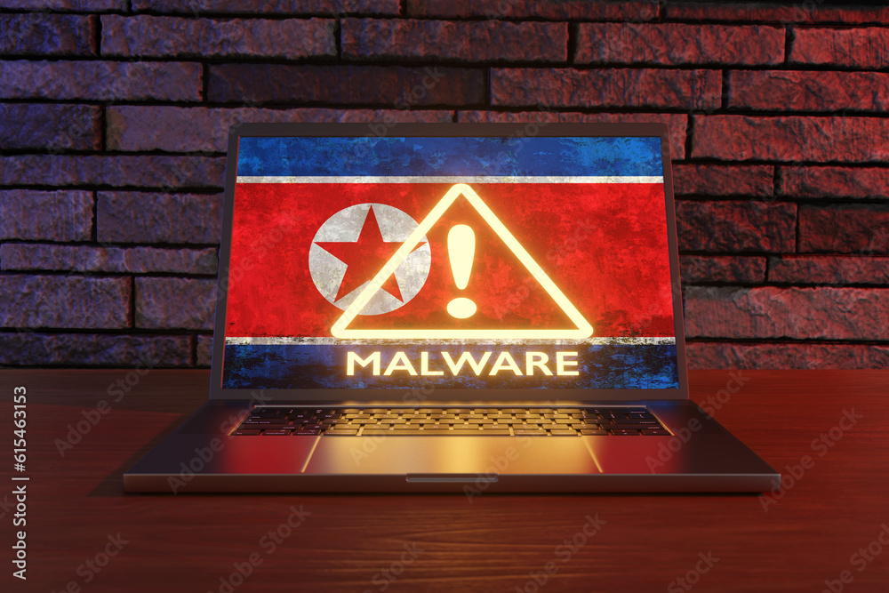Laptop showing the national flag of North Korea and a warning sign of ...