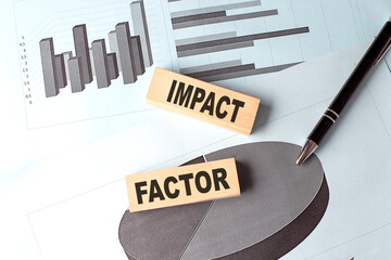Poster - IMPACT FACTOR text on wooden block on chart background