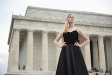 Portrait Of A Teenage Girl At The National Mall With The Lincoln Memorial In The Background, Washington DC, USA; Washington, District Of Columbia, United States Of America