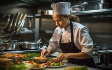 Female Chef Working In A Professional Kitchen