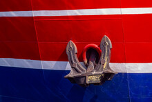 Anchor Of A Large, Brightly Painted Ship; Nantucket, Massachusetts, United States Of America