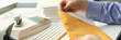 © H_Ko - Man holds apaper envelope with business mail at workplace. Receiving correspondence and bank notifications
