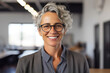 © Stock'd  - smiling woman with short gray hair and glasses in office portrait, made with generative ai