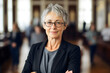 © Stock'd  - smiling senior woman with short gray hair in office portrait, made with generative ai