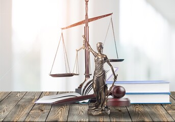 Wall Mural - Legal concept. Statue of Justice and wooden gavel on table.