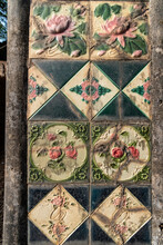 Vintage Portuguese Era Tiles And Inlays With Floral Patterns On The Walls Of An Ancient Building In Madgaon.