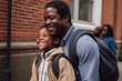 © ADDICTIVE STOCK - Generative AI illustration portrait of happy African American father and son with backpack laughing together while smiling and looking away on street