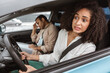 © Prostock-studio - Scared arabic lady driver driving while instuctor man sitting inside