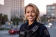 Portrait of a beautiful police woman on the street at sunset.
