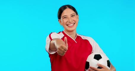 Canvas Print - Sports, thumbs up and soccer with face of woman in studio for winner, motivation or support. Football, success and mockup with portrait of female athlete on blue background for thank you and training