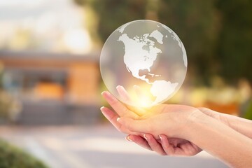 Canvas Print - Protecting concept, hand holds a globe