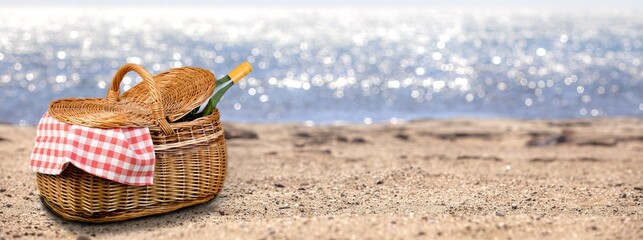 Poster - Classic picnic basket with a wine bottle