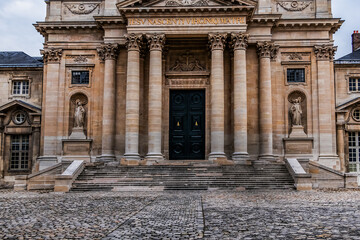 Wall Mural - Architectural fragments of Paris Val-de-Grace Church at Place Alphonse Laveran. Сhurch and monastery of Val-de-Grace was built in middle of XVII th century by Queen Anne of Austria. Paris. France.