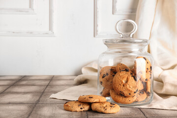 Wall Mural - Jar with cookies and towel on grey tile table