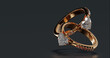 © CatNap Studio - 3D render design of two gold diamond rings floating on black background. heart shape diamond