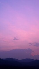 Wall Mural - twilight and dawn sky with cumulus cloud vertical time lapse in an evening.