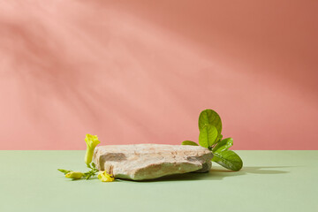 Sticker - Abstract background for branding and minimal presentation of cosmetics products with gray stone, yellow flowers and green leaf decorated on pastel background with leaf shadow. Front view.