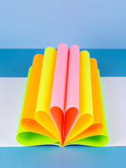 Poster - Colorful paper sheet background  isolated on blue, close up