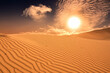 Wüstensand mit scheinender Sonne